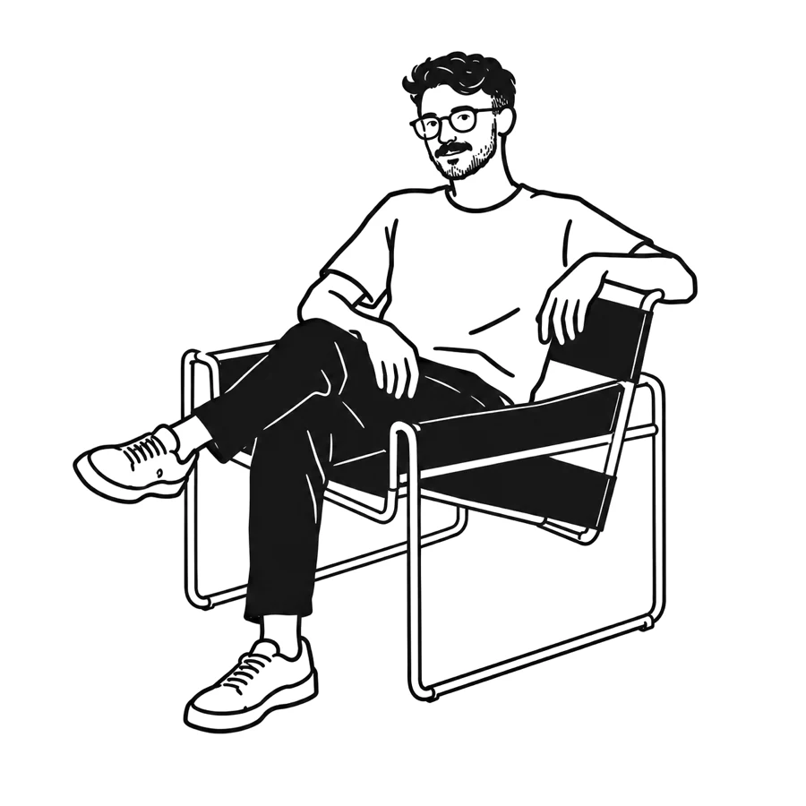 Doron seated in a chair