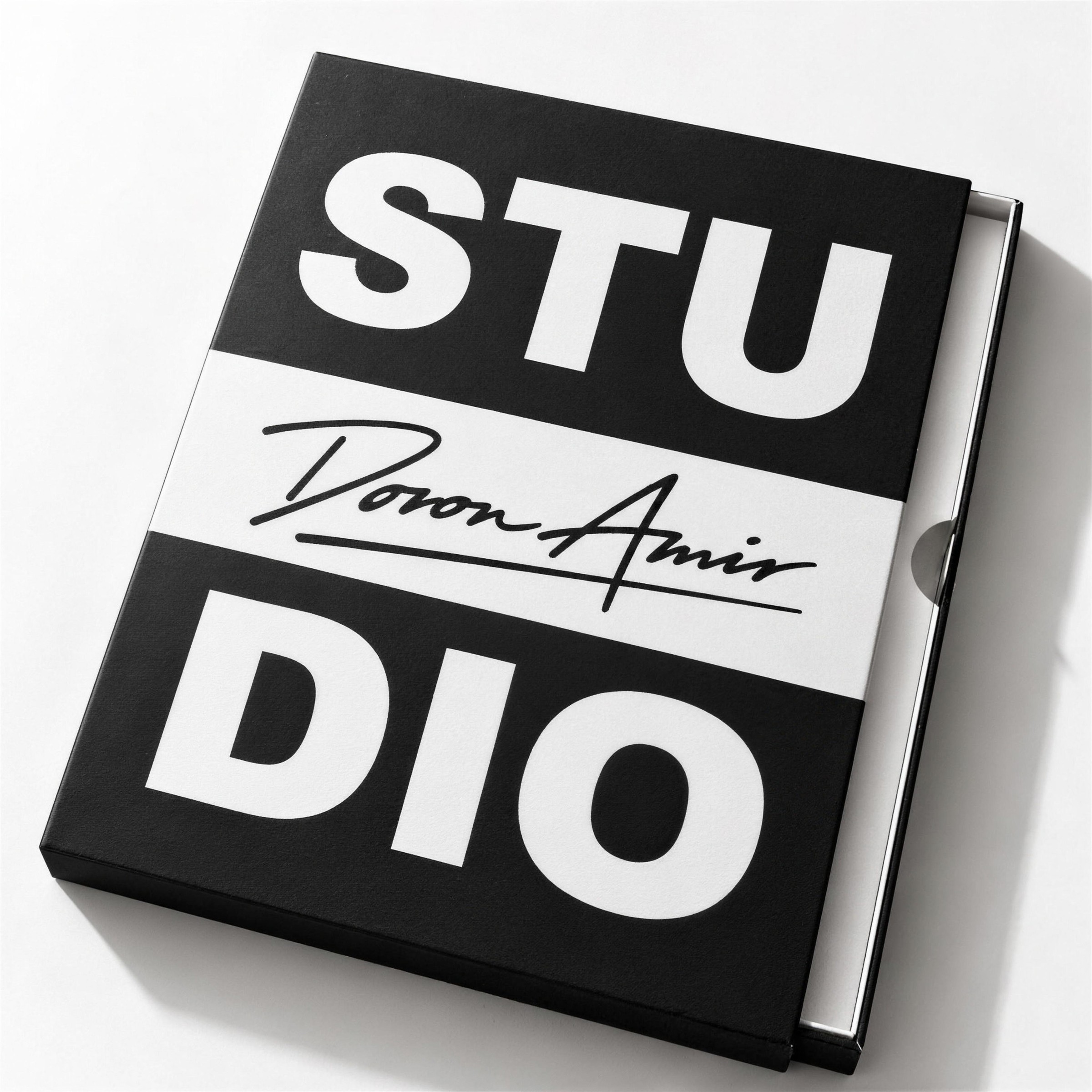 Black box packaging printed with STUDIO and the signature