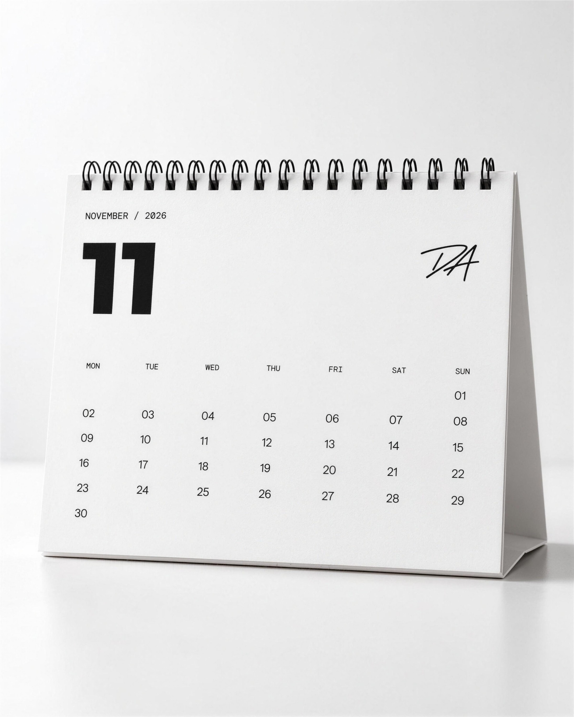 Desk calendar for November with the DA monogram