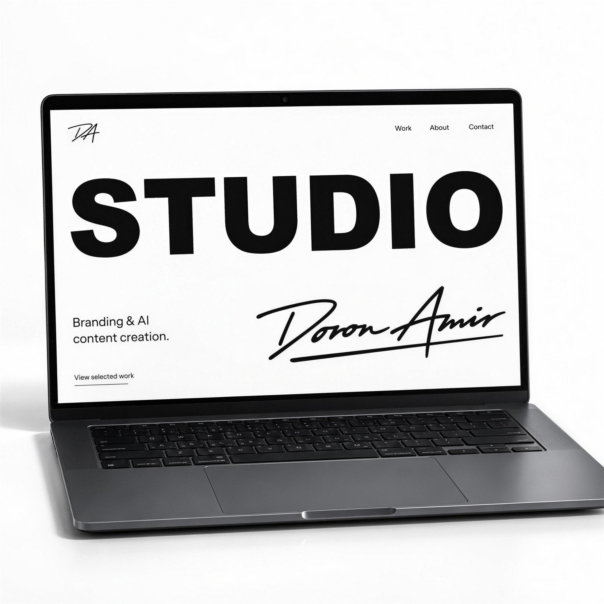 Laptop showing the Studio Doron Amir website with STUDIO and the signature